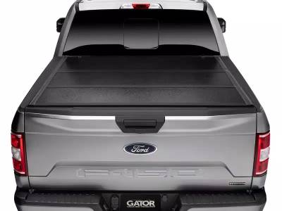 Undercover - Tapa plegable Gator de 5' para Hilux / Frison T6 / Frison T8
